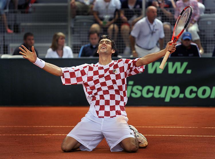 THANK YOU: Croatia's Marin Cilic celebrates and thanks the home crowd for their support after leading his nation into the Davis Cup semifinal. (Hrvoje Polan/AFP/Getty Images) THANK YOU: Croatia's Marin Cilic celebrates and thanks the home crowd for their support after leading his nation into the Davis Cup semifinal. (Hrvoje Polan/AFP/Getty Images)