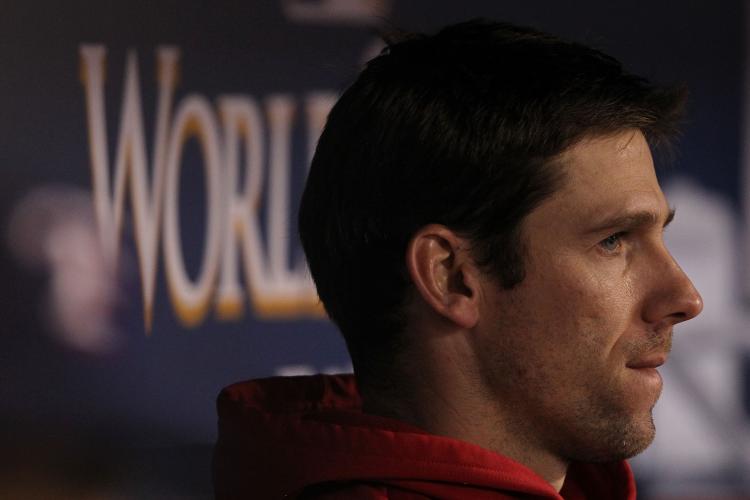 Cliff Lee #33 of the Texas Rangers looks on from the dugout against the San Francisco Giants in Game Five of the 2010 MLB World Series at Rangers Ballpark in Arlington on November 1, 2010 in Arlington, Texas. (Ronald Martinez/Getty Images)