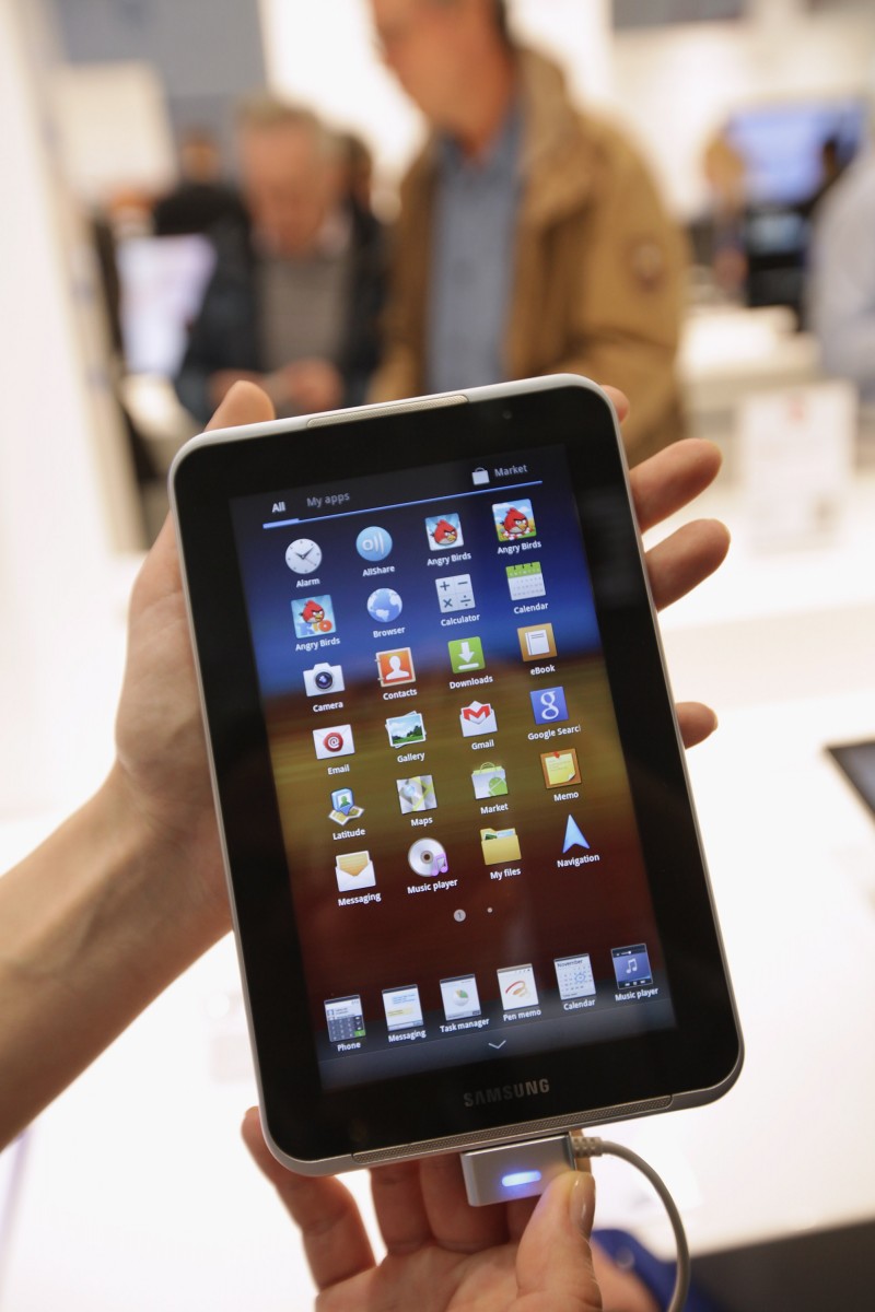 CLOUD POWER: A stand hostess holds up a Samsung tablet PC on the first day of the CeBIT 2012 technology trade fair on March 6th, 2012 in Hanover, Germany. Advances in cloud computing and security were major features at the fair this year