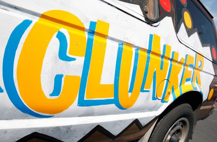 A painted Dodge Ram Van advertises the federal 'Cash for Clunkers' program at United Suzuki Mitsubishi August 21, 2009 in Las Vegas, Nevada. (Ethan Miller/Getty Images)