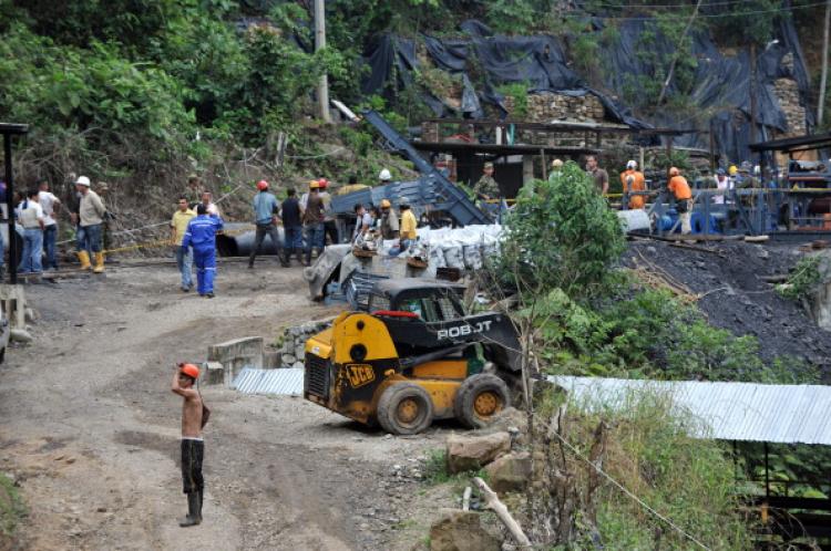 Miners stand by the mine entrance after 'La Preciosa' coal mine exploded in Corregimiento San Roque, Sardinata's municipality, department of Norte de Santander, Colombia on January 26, 2011. (Guillermo Legaria/AFP/Getty Images)