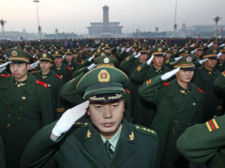 Chinese People's Armed Police responsible for the security of Tiananmen Square and the Forbidden City gather for a ceremony to mark the handover of guard duties on Tiananmen Square in Beijing on November 23, 2009. (STR/AFP/Getty Images)