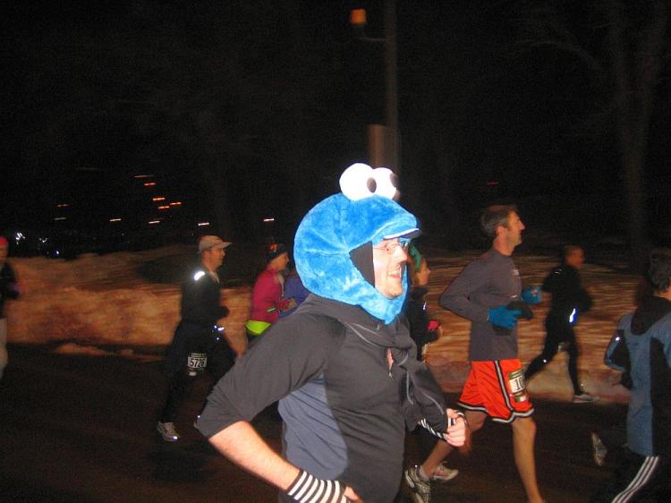 A man wearing a Cookie Monster costume runs in the annual Emerald Nuts Midnight Run in Central Park on New Year's Eve.  (Christian Watjen/The Epoch Times)