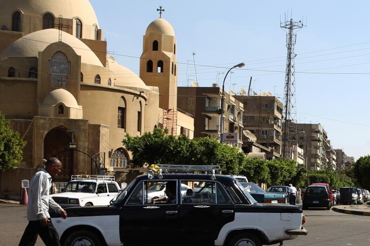 Coptic Christian churches in Europe are under heavy security protection following terrorist threats published on an Islamic website. Above, an Egyptian man walks in front of a Coptic church in Cairo on Nov. 2, 2010.  (KHALED DESOUKI/AFP/Getty Images)