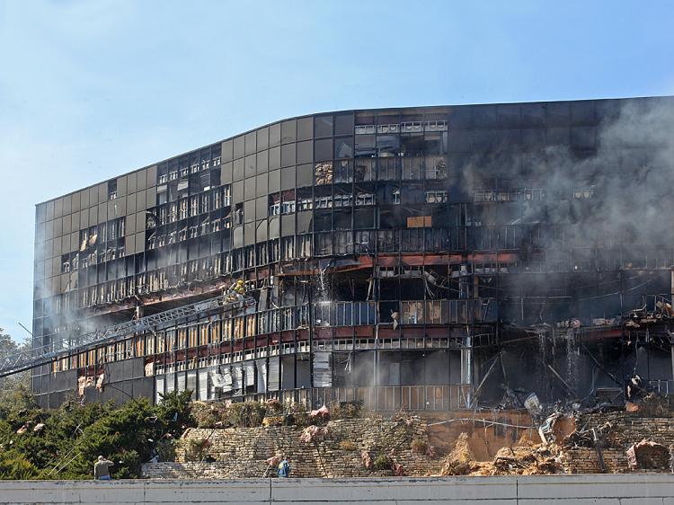 Smoke billows from a building that houses IRS offices after a small plane crashed into it February 18, 2010 in Austin, Texas. (Jana Birchum/Getty Images)