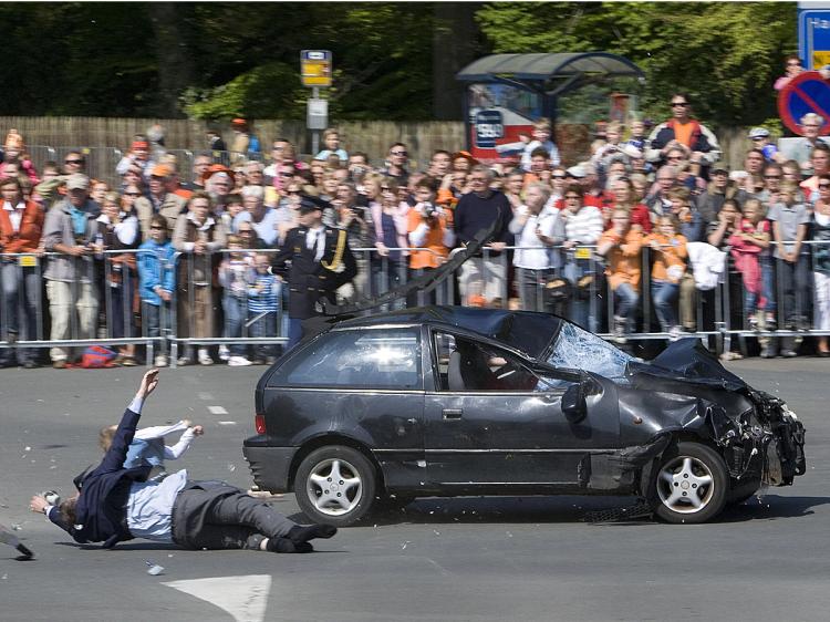 A car crashes into the crowd waiting for the visit of the royal family in Apeldoorn on April 30, 2009.    (Robin Utrecht/AFP/Getty Images)