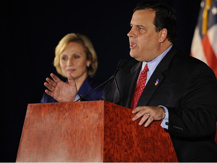 New Jersey Governor-Elect Chris Christie speaks to election-night supporters as Lt. Governor-elect Kim Guadagno listens November 3, 2009 in Parsippany New Jersey. (Stephen Chernin/Getty Images)