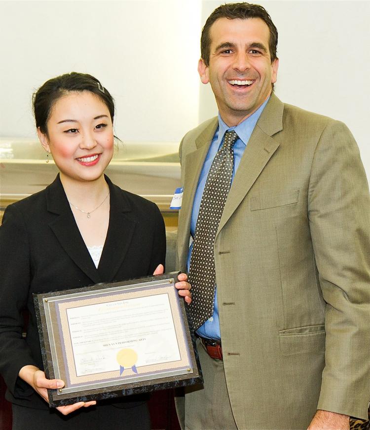 San Jose City Councilmember Sam Liccardo (R) presents a commendation to Kelly Wen, one of the two masters of ceremonies for Shen Yun Performing Arts New York Company.  (Jan Jekielek/The Epoch Times)