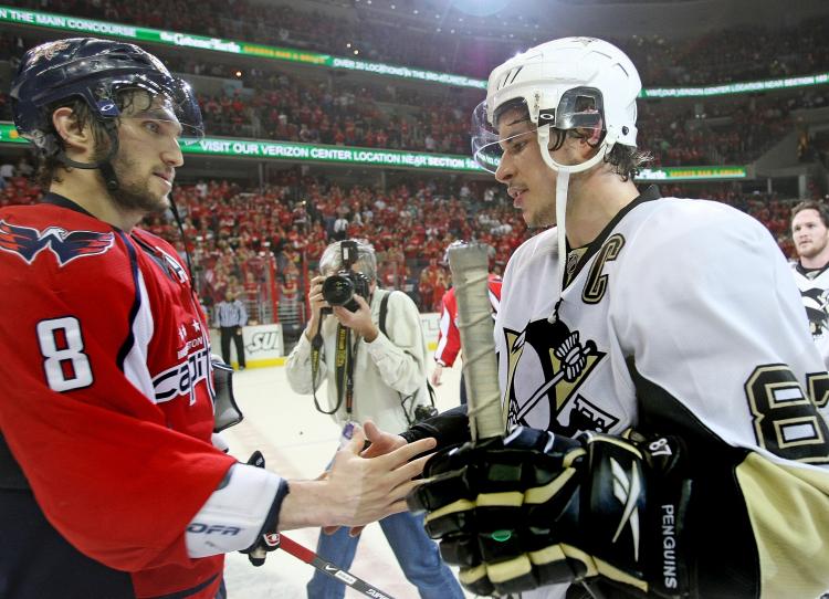 GOOD FOR NHL: Alex Ovechkin and Sidney Crosby shake hands after a blockbuster seven-game series was won by the Penguins last season. (Bruce Bennett/Getty Images)