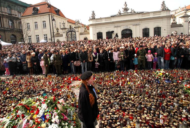 Thousands of Polish people observe a minute of silence as they pay their respects in memory of the victims of the air-crash in which President Lech Kaczynski was killed in front of the presidential palace in Warsaw on April 11, 2010. (Joe Klamar/AFP/Getty Images)