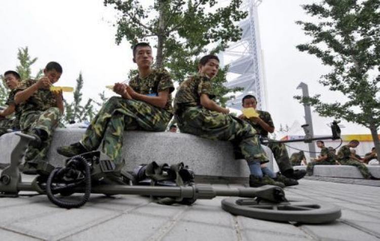 Foreign visitors, officials and media alike have complained that the martial-law like atmosphere in Beijing is detracting from the fun spirit that should be present at the Games.  (Jewel Samad/AFP/Getty Images )
