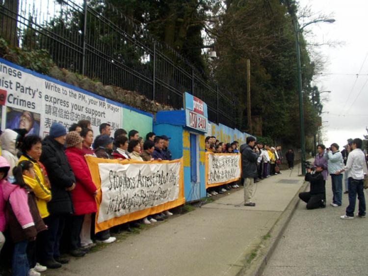A Falun Gong practitioner stands outside the shelter that the City of Vancouver says violates a bylaw. The Falun Gong have maintained a 7-year vigil outside the Chinese consulate on Granville St. to raise awareness of the persecution of their counterparts in China. (www.clearwisdom.net)