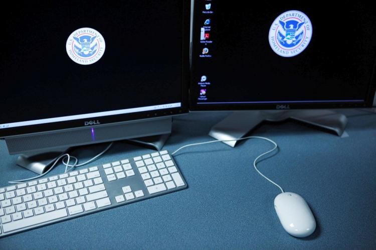 The logos of the U.S. Department of Homeland Security on computer terminals in a training room of the Cyber Crimes Center of the U.S. Immigration and Customs Enforcement. (Alex Wong/Getty Images)