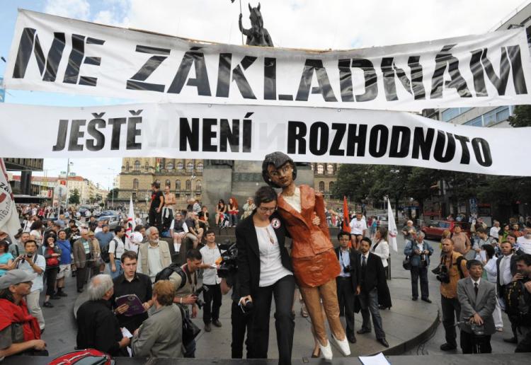 A protester carries a effigy of U.S. Secretary of State Condoleezza Rice under a banner saying ''No to bases, it hasn't been decided yet'' where several hundreds of Czech demonstrators protested against installing a U.S. radar station. The protest took pl (Joe Klamar/AFP/Getty Images)