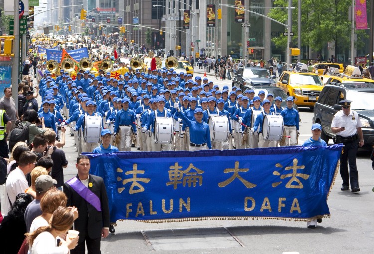 THE NEW CHINA: Falun Gong practitioners will hold a parade that is both colorfully cultural and a solemn remembrance of lives lost in persecution in Manhattan's Chinatown on Saturday, Aug. 27, at 1 p.m.  (Dai Bing/The Epoch Times)