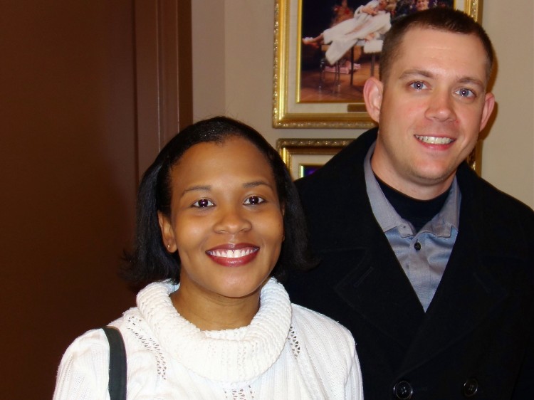 Mrs. Denata Hartley (L) and her husband, Army Sergeant Adam Hartley attend Shen Yun