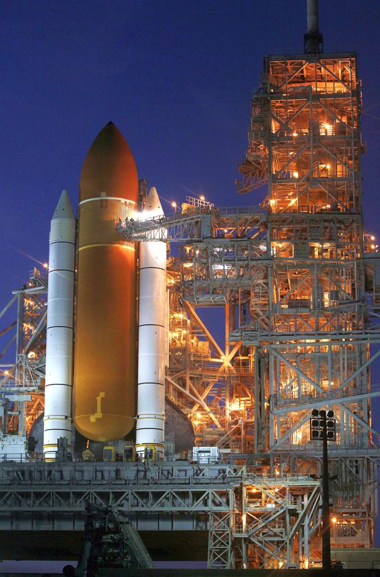 READY TO LAUNCH: Space shuttle Discovery sits on the launch pad as it is prepared for a scheduled Feb. 24 launch at Kennedy Space Center in Cape Canaveral, Fla. Space is a fragile place, not ruled by any nation, yet vital to modern military operations and modern lifestyles. (Joe Raedle/Getty Images)