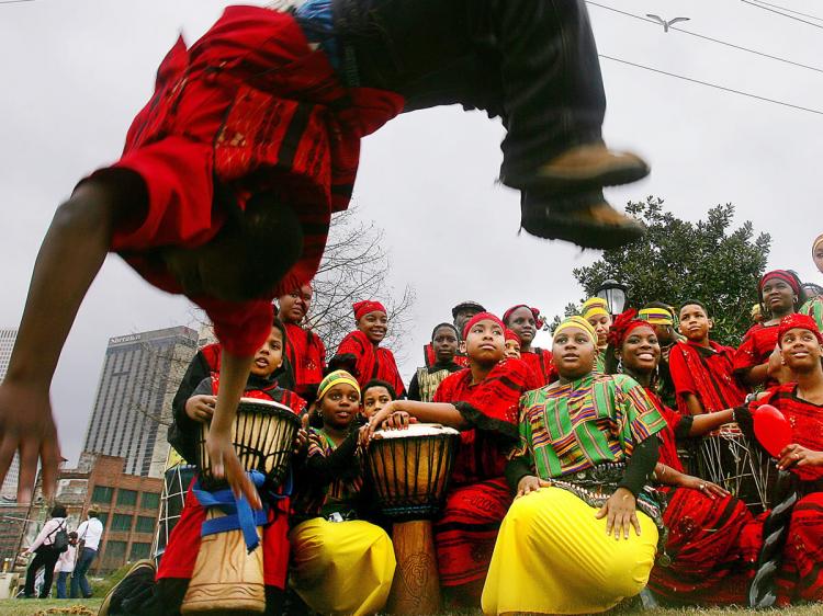 A GOOD TIME: The Djembe drum is a part of everyday life of African people. B.W. Cooper Dance and Drum Troupe, an African-inspired group at Mardi Gras festivities in New Orleans, Louisiana. (Mario Tama/Getty Images)
