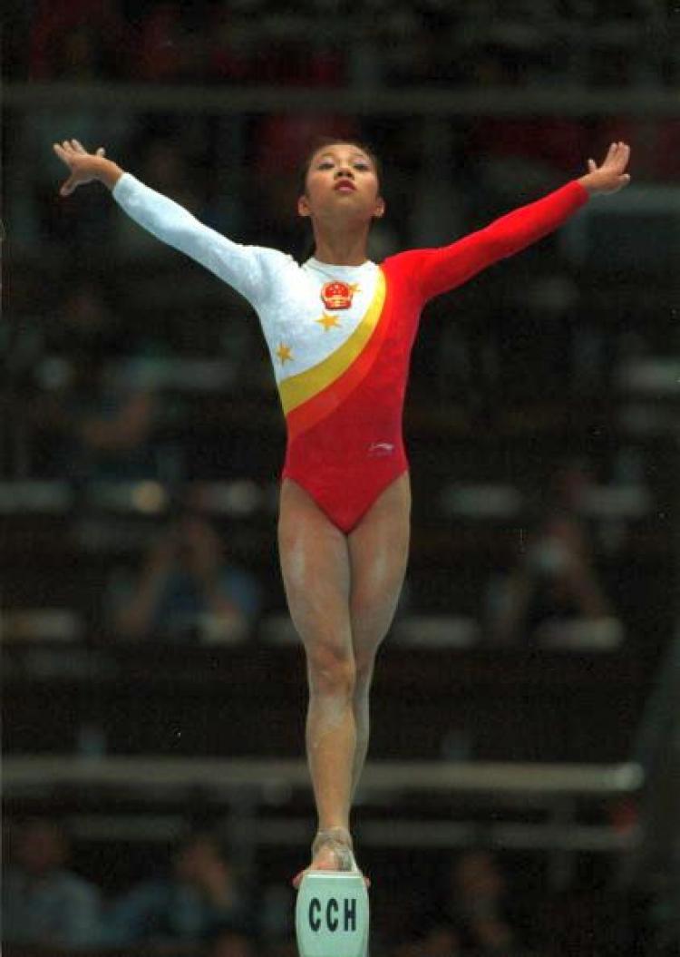 Fangxiao Dong of China performs her balance beam routine during the womens teams final at the 1999 Tianjin World Gymnastics Championships, Tianjin, China. China finished third. (Jack Atley/ALLSPORT)