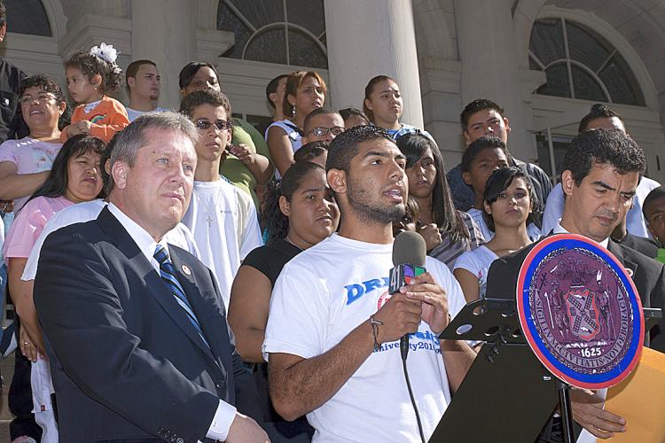 DREAM ACT: A New York City immigrant high school senior (C) who does not have a Social Security number describes his challenges in obtaining funding for college. Council members Daniel Dromm (L) and Ydanis Rodriguez (R) joined the student at a rally at City Hall in support of the DREAM Act on Wednesday in New York City. (Henry Lam/The Epoch Times)