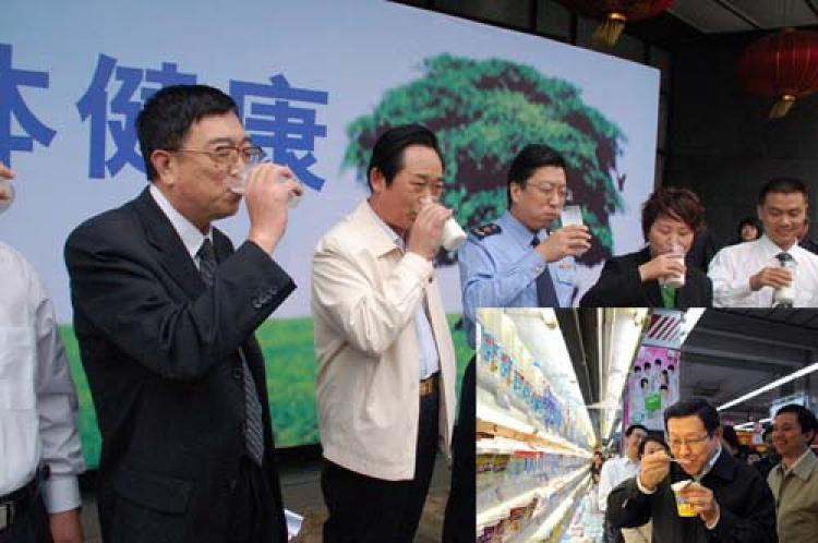 The deputy mayor of Shijiazhuang and other government officials drink dairy products in public to convince the public that milk is now safe. (The Epoch Times)