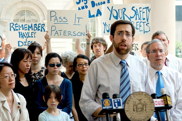State Sen. Daniel Squadron (at microphone) along with Councilwoman Margaret Chin (far left) Manhattan Borough President Scott Stringer (R), stand with the family members of Hayley Ng and Diego Martinez, two children who were killed when a van driver left  (Henry Lam/The Epoch Times)