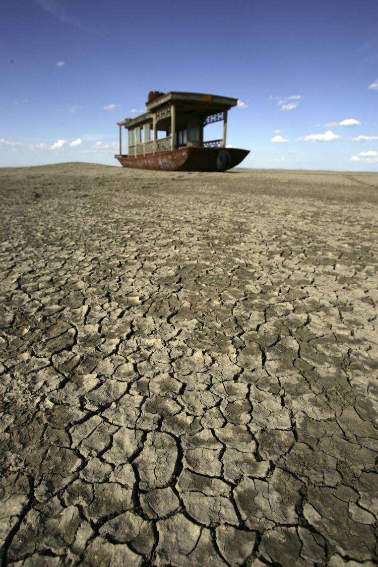 A sightseeing boat is grounded on the cracked bottom of the dried Angulinao Lake in Zhangbei County of Hebei Province, north China.  (China Photos/Getty Images)