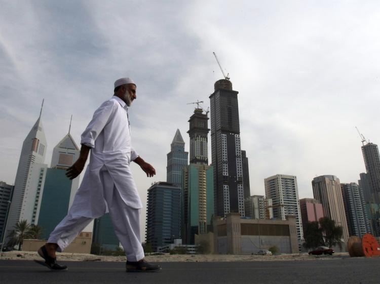 A man walks at the construction site of Dubai's Business Bay in the Gulf emirate on November 29, 2009. (Karim Sahib/AFP/Getty Images)