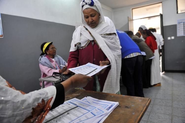 An Ethiopian woman gets ballot papers at a polling station on May 23, in the capital Addis Ababa. Ethiopians began voting in legislative elections on May 23. Prime Minister Meles Zenawi appeared set for re-election although the main opposition party Medrek, has made allegations of election fraud in some areas. (Simon Maina/AFP/Getty Images)