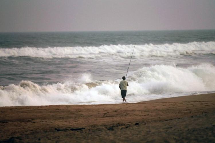OMINOUS: A man fishes in rough surf on Friday in Montauk, New York. Much of the East Coast is preparing for Hurricane Earl. (Spencer Platt/Getty Images)