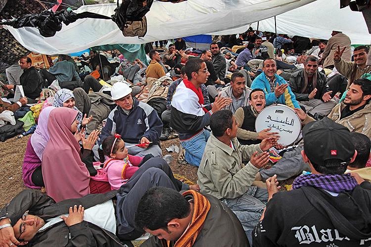EGYPT PROTESTS: Anti-government protesters sing while under makeshift tenting in Tahrir Square on February 7, 2011 in Cairo, Egypt. (John Moore/Getty Images) EGYPT PROTESTS: Anti-government protesters sing while under makeshift tenting in Tahrir Square on February 7, 2011 in Cairo, Egypt. (John Moore/Getty Images)