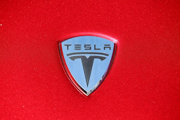 Electric cars: The Tesla Motors logo is seen on the hood of a car at Tesla Motors headquarters May 20, 2010 in Palo Alto, California.  (Justin Sullivan/Getty Images)