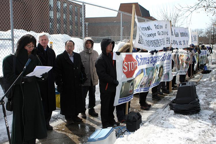 Grace Wollensak, speaking for the Falun Dafa Association of Canada at a rally in front of the Chinese Embassy, calling for the release of renowned human rights lawyer Gao Zhisheng. Beside her is former Secretary of State for Asia-Pacific David Kilgour.  (Samira Bouaou/The Epoch Times)