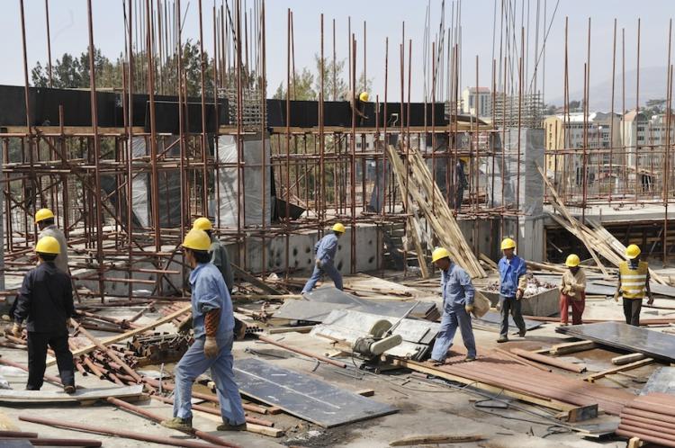 HINDRENCE? Chinese workers of the China State Construction Engineering Corporation (CSCEC) work on January 30, at the site of the new African Union (AU) conference center in Addis Ababa, Ethiopia. (SIMON MAINA/AFP/Getty Images)  (Simon Maina/Getty Images)