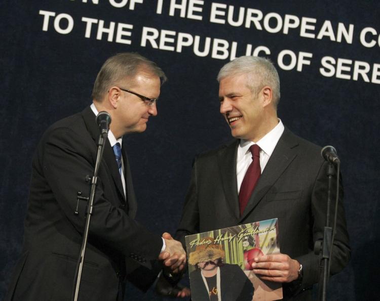 EU enlargement chief Olli Rehn (L) EU enlargement chief Olli Rehn (L) hands a personal gift, to the Serbian President Boris Tadic (R). Rehn supports the suspension of visas for Serbian citizens for Schengen territory to be carried out till the end of the Czech presidency of the European Union (Andrej Isakovic/AFP/Getty Images)