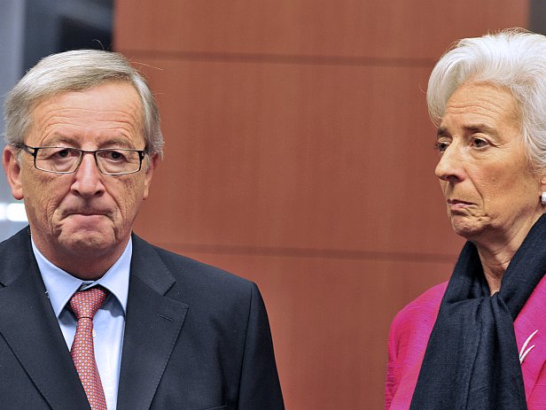 Eurogroup chairman and Luxembourg Prime Minister Jean-Claude Juncker (L) speaks with International Monetary Fund Managing Director Christine Lagarde (R) prior a eurozone meeting on Nov. 12, 2012, at the EU Headquarters in Brussels, Belgium. Eurozone finance ministers consider the next steps to bring Greece back from the brink of bankruptcy after Athens received a 'positive' report card from its international creditors. 