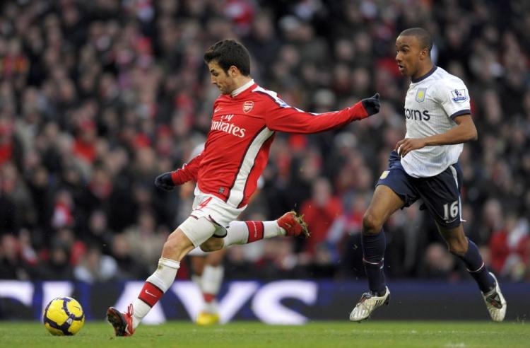 Cesc Fabregas scores his second goal of the game during his brief cameo. (Adrian Dennis/AFP/Getty Images)