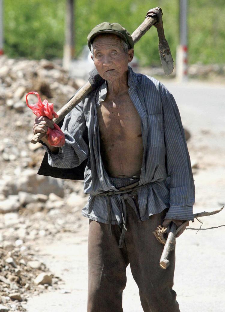 An elderly Chinese farmer in the outskirts of Beijing, 2007.  (STR/AFP/Getty Images)