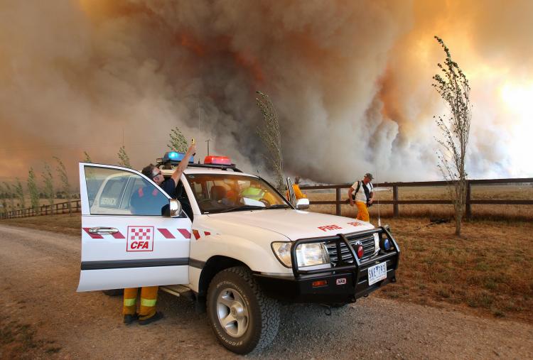 Country Fire Authority staff monitor a giant fire raging in the Bunyip State Park near Labertouche on February 7, 2009. (William West/AFP/Getty Images)