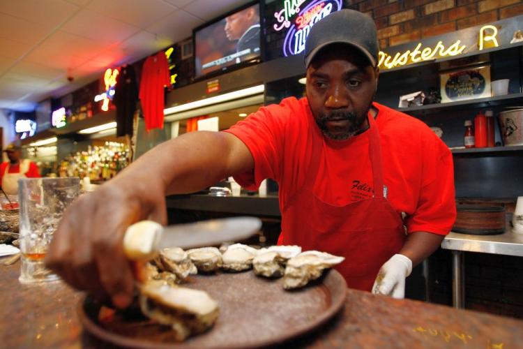 Keith Chancley shucks fresh Louisiana Oysters at Felix's Restaurant on Bourbon Street, New Orleans, as federal officials close commercial and recreational fishing from Louisiana to Florida. (Chris Graythen/Getty Images)