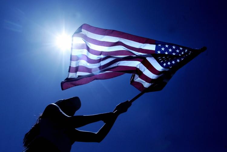 FREEDOM REIGNS: Crew members of the US merchant ship Maersk Alabama gather around a US flag while celebrating that the captain of their ship which had been held captive by the pirates had been freed on Sunday.  (Roberto Schmidt/AFP/Getty Images)