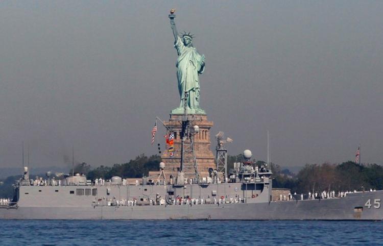 Sailors abroad the USS Comstock LSD 45 pass by the Statue of Liberty as it travels in New York Harbor May 26, 2010 in New York City. The 23rd annual Fleet Week, which honors the U.S. Navy and Marine Corps., begins today with eleven naval vessels heading into port where the ships and the sailors aboard will spend their week in the city. (Chris Hondros/Getty Images)