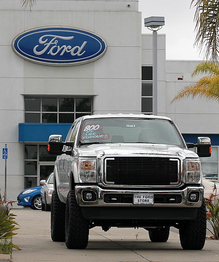PROFITABLE: A new Ford truck is displayed on the sales lot at The Ford Store on July 26, in San Leandro, Calif. Ford Motor Company reported its ninth consecutive quarterly profit with second-quarter earnings of $2.4 billion or 59 cents a share compared to $2.6 billion, or 61 cents a share one year ago. (Justin Sullivan/Getty Images)