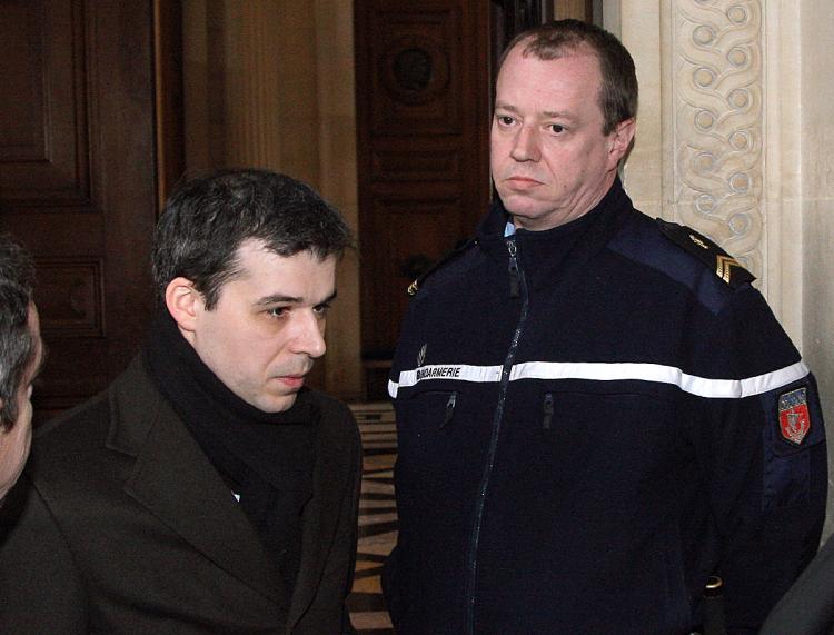 French judge Fabrice Burgaud (L), 37, the magistrate at the centre of one of France's biggest judicial fiascos, leaves on February 2, 2009 Paris' courthouse, after a hearing by top justice committee, the Conseil Superieur de la Magistrature.    (Patrick Kovarik/AFP/Getty Images)