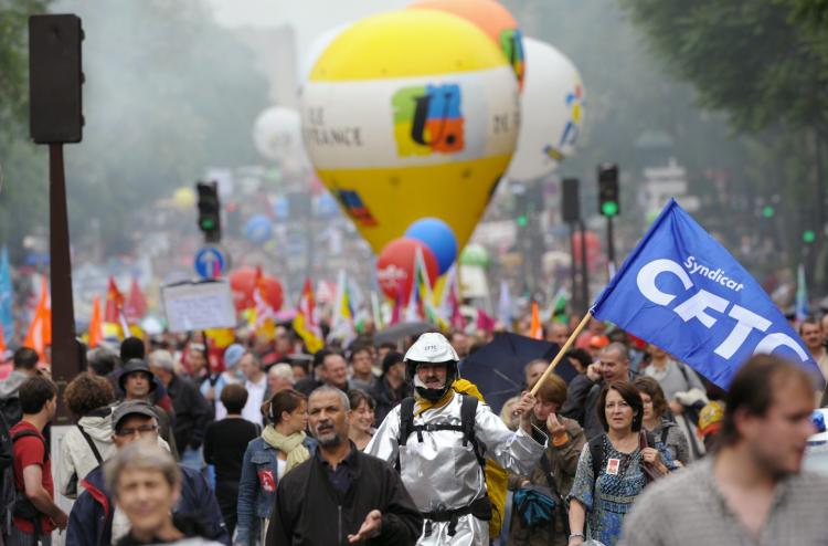 People demonstrate during a nationwide day strike called by unions to protest against the pension overhaul, on May 27, 2010, in Paris. (Bertrand Langlois/AFP/Getty Images)