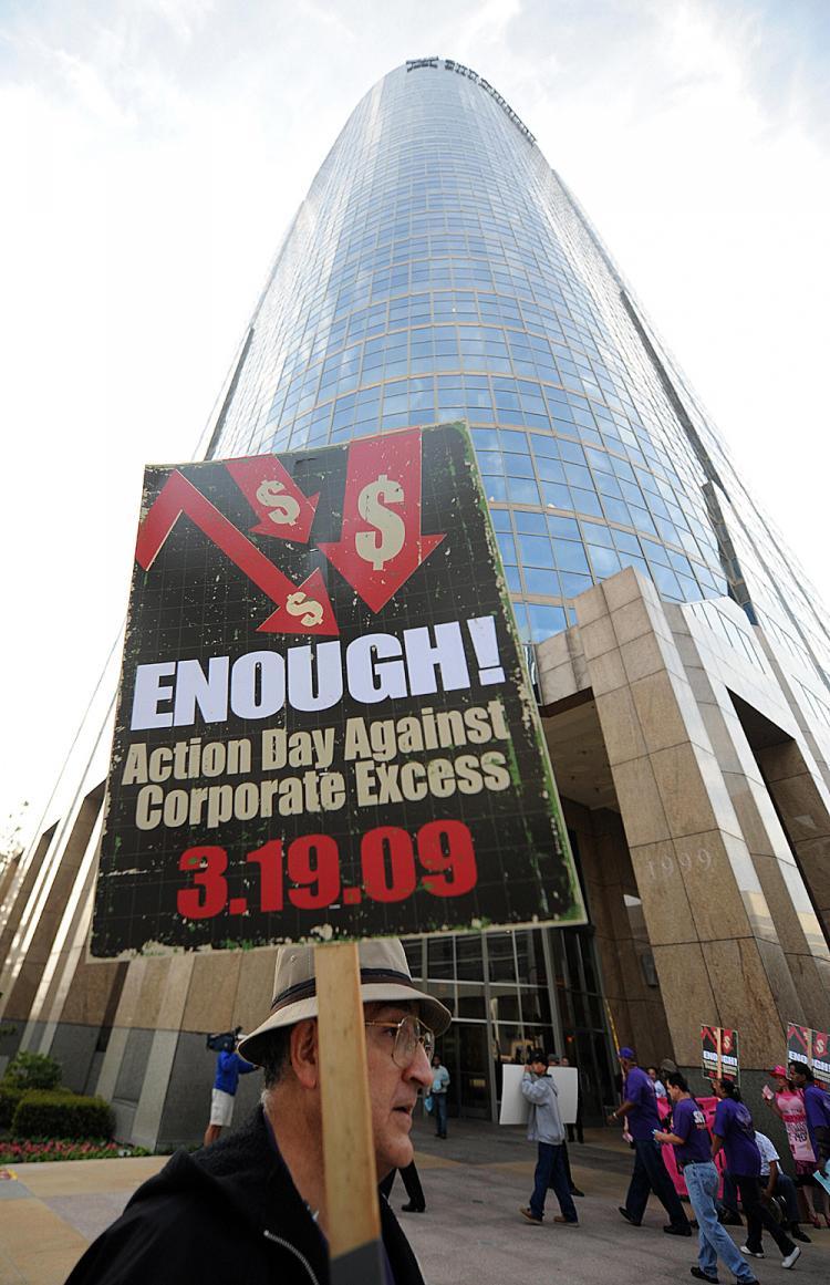 People protest against corporate bailouts in front of AIG office during the nationwide 'Take Back the Economy' protest in Los Angeles on March 19, 2009. (Gabriel Bouys/AFP/Getty Images)