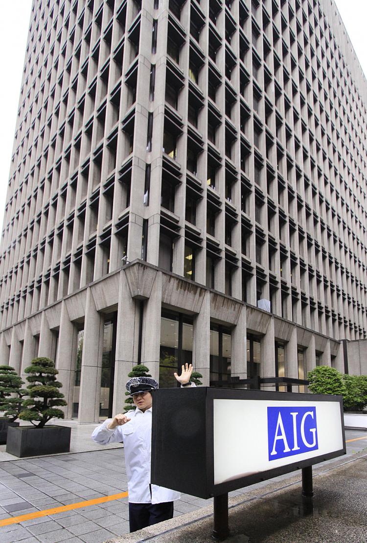 AIG, after repeated bail-outs and rescues, is now hugely profitable, and is planning more employee bonuses. (Yoshikazu Tsuno/AFP/Getty Images)