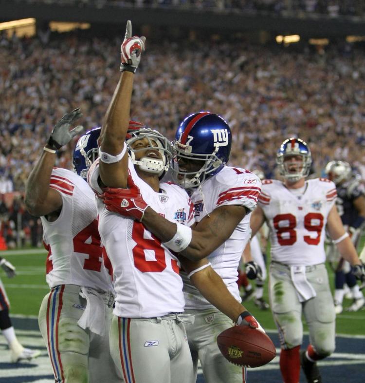The New York Giants won Super Bowl XLII in Phoenix as a wildcard team, winning three road games just to get to the chance to ruin New England's perfect season in 2008. (Timothy A. Clary/AFP/Getty Images)