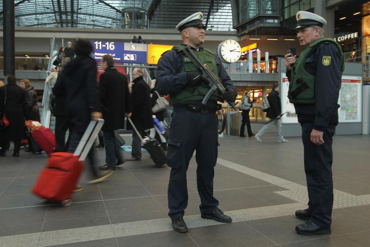 German policemen armed with a submachine gun keeps a watchful eye among travelers at Hauptbahnhof main railway station on November 17, 2010 in Berlin, Germany.  (Sean Gallup/Getty Images)
