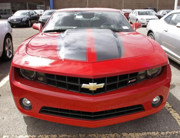 A new 2010 Chevrolet Camaro sits in the lot for sale at a General Motors dealership in Troy, Michigan. In November, GM's sales increased by 21 percent over the same period in 2009. (Bill Pugliano/Getty Images)